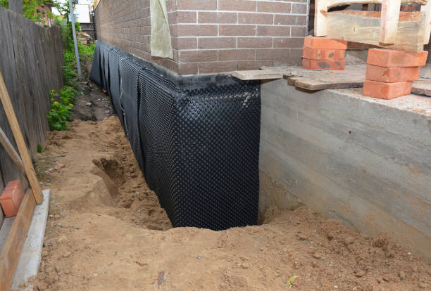 Happy homeowners after waterproofing job in Westfield